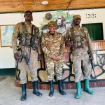 Why Ugandan rangers carry guns