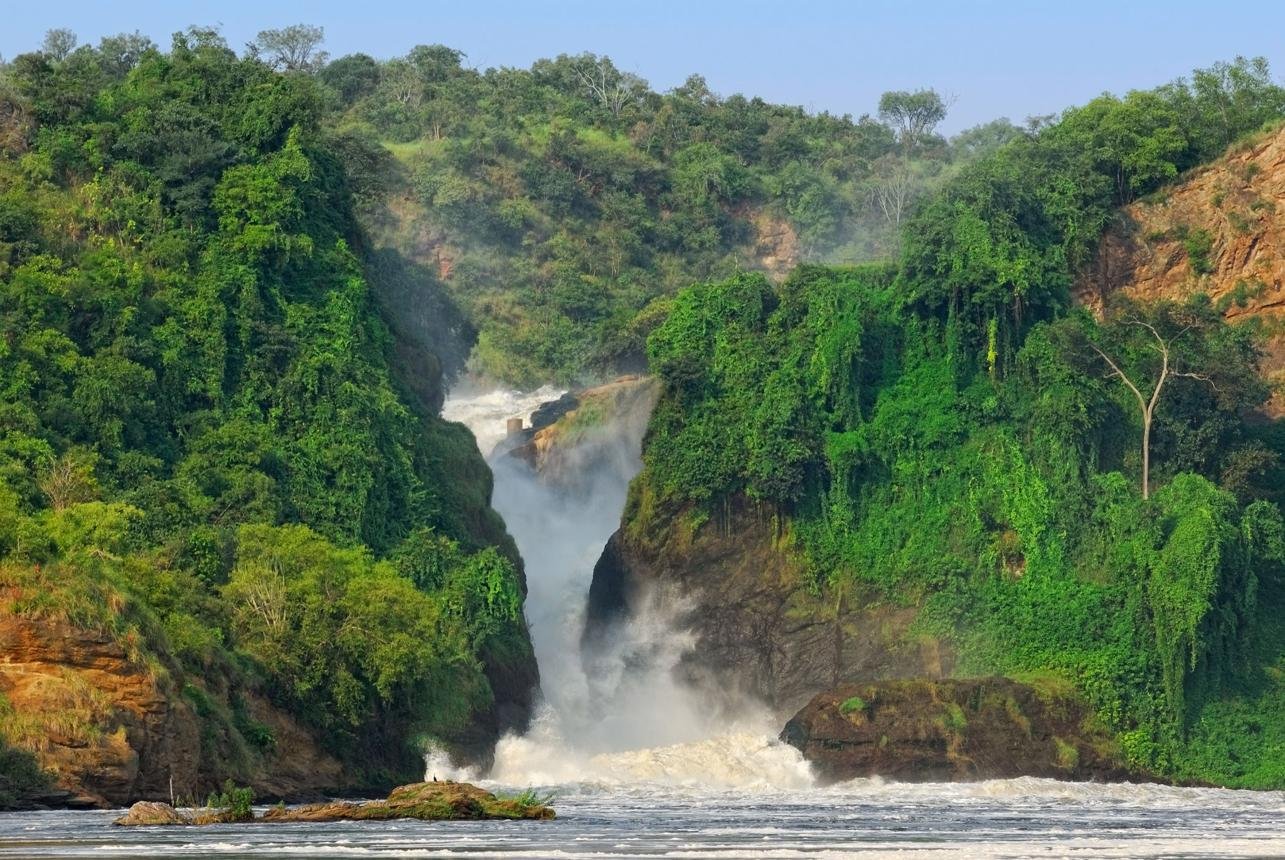 Powerful Murchison Falls flowing through a narrow rocky gorge in Uganda.