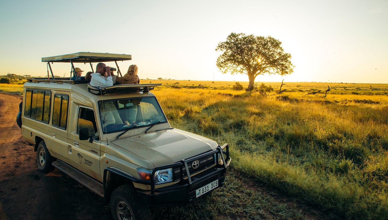 Private safari Land Cruiser exploring East Africa during an AFCON 2027 football and wildlife holiday.