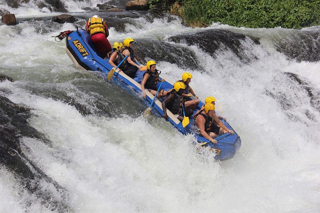 Visitors enjoying white-water rafting on the Nile River in Jinja Uganda