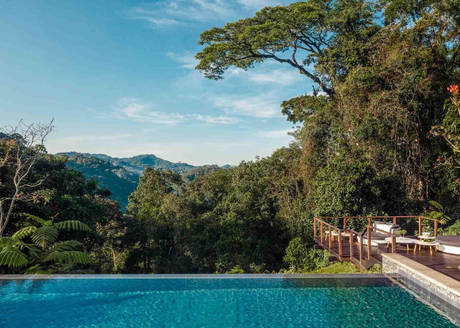Luxury accommodation at One&Only Nyungwe House overlooking Rwanda's lush tea plantations and forest.