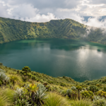 Illustrated crater lake surrounded by green volcanic slopes and mountain mist.