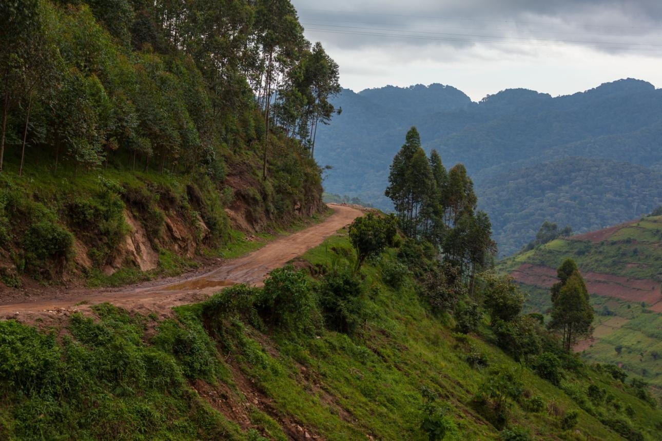 Winding mountain road through southwestern Uganda toward Bwindi gorilla trekking sectors