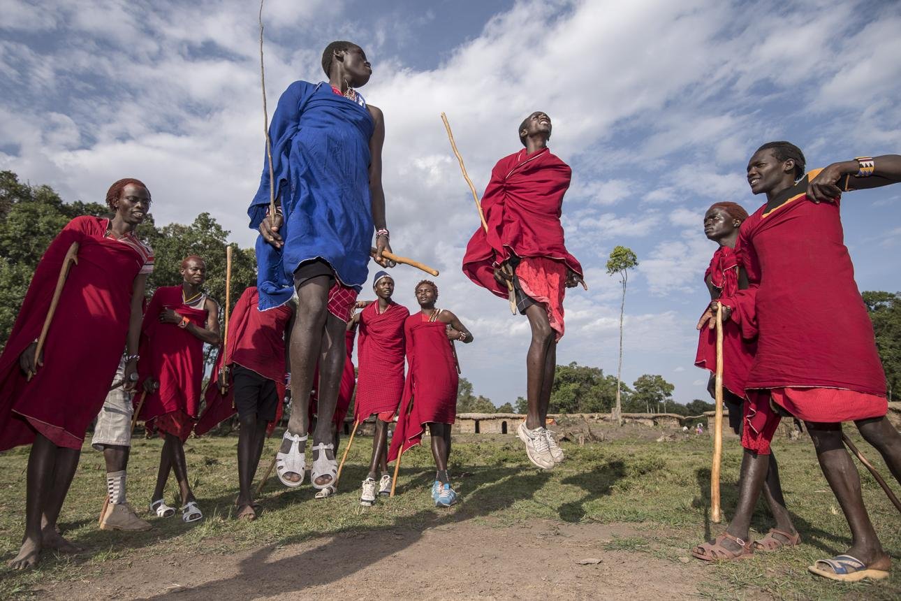 Maasai men performing the traditional Adumu jumping dance during a cultural gathering in Kenya.