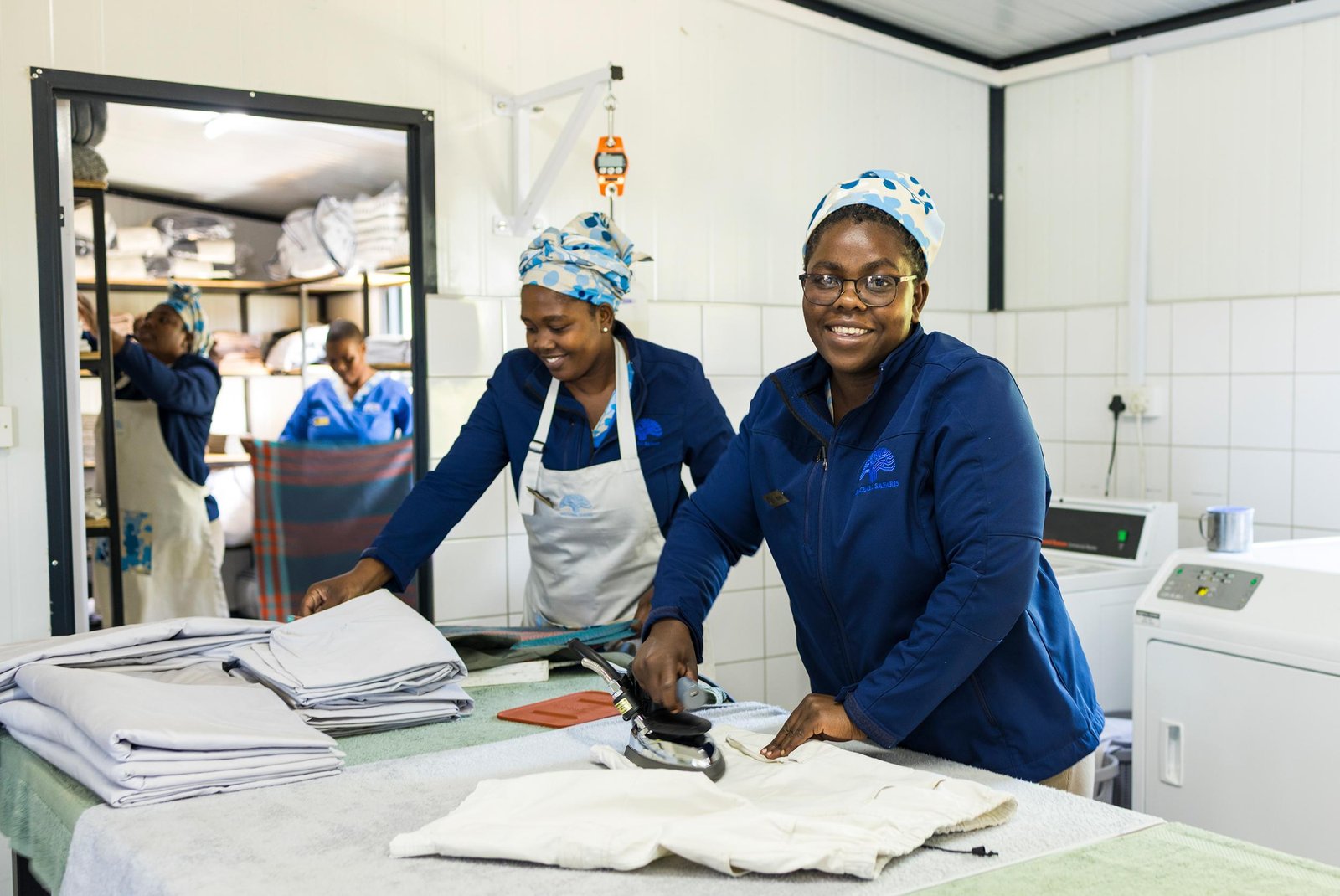 Laundry service at a Uganda safari lodge with clean clothes and towels.