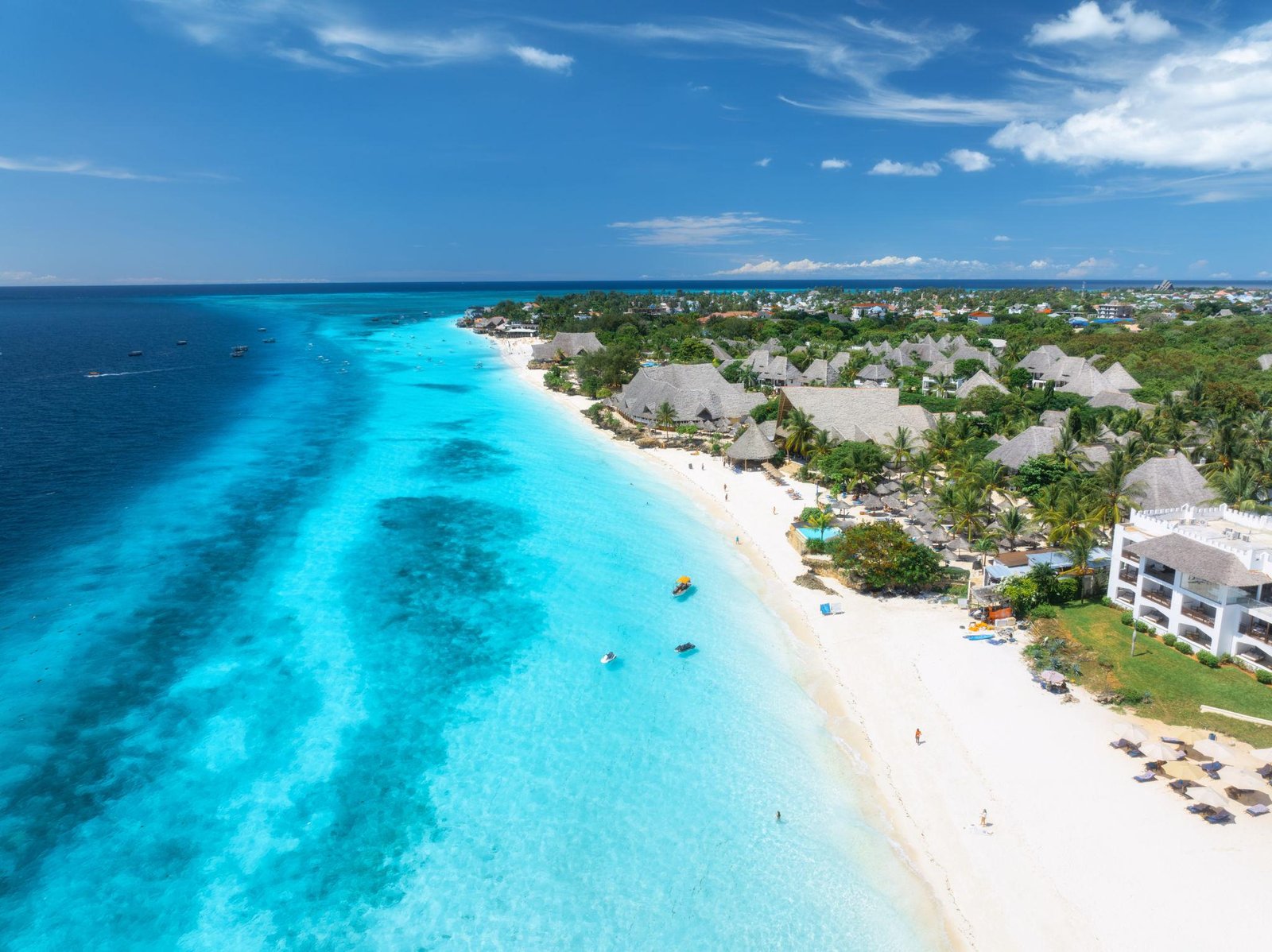 Beautiful white-sand beach and turquoise Indian Ocean waters in Zanzibar, Tanzania.